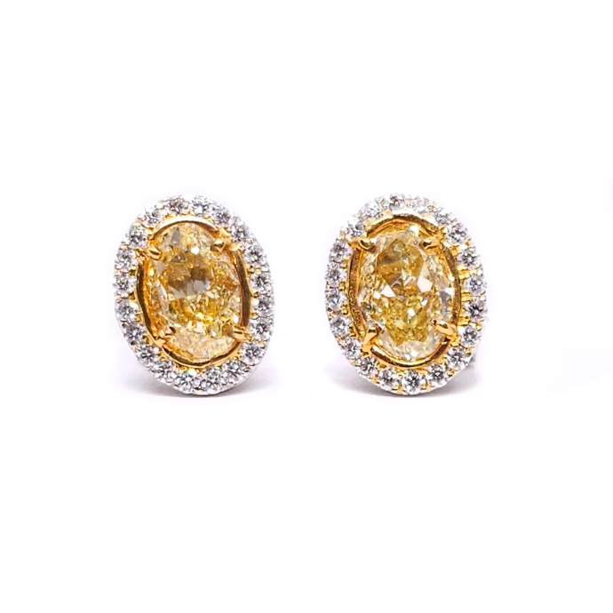 Diamond Yellow Oval Halo Stud Earrings 3.13 Carats in Platinum and 18K Yellow Gold with GIA Certificate