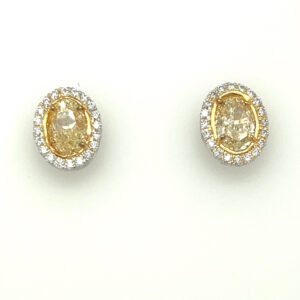 4.08 carats Natural Yellow Diamond Earrings Oval Shape. Plat/18 KYG Halo. GIA.